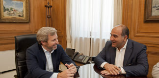 Manzur junto a Frigerio.